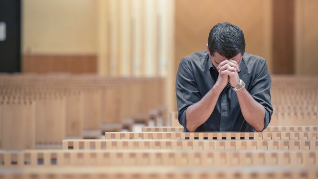 CHURCH-MAN-ALONE-shutterstock_575854621.jpg