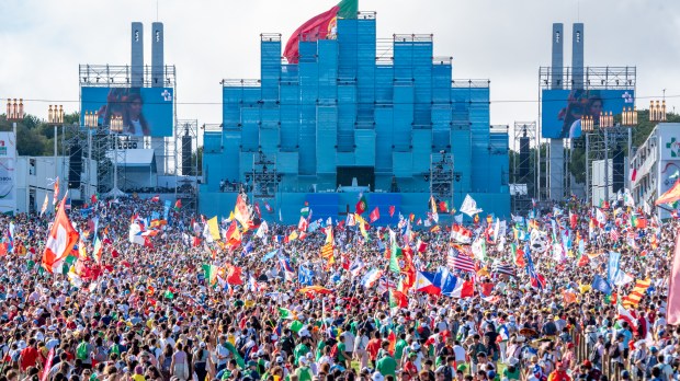 Pilgrims attend the opening mass of the World Youth Day 2023