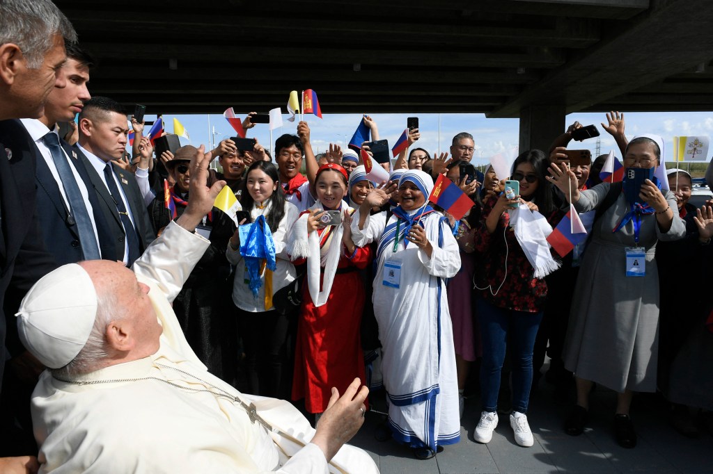 people greeting Pope Francis upon his arrival at the Apostolic Prefecture of Ulaanbaatar