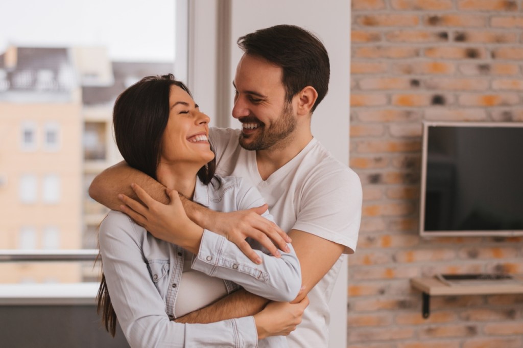 Beautiful couple hugging and looking at each other