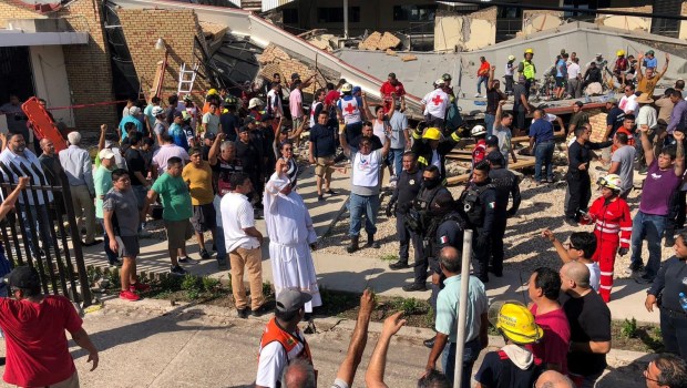 Priest and volunteers help rescue people at Mexico church collapse