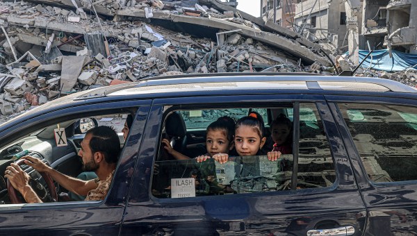 Family drives through rubble of Gaza Strip