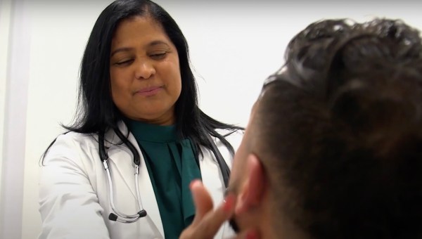 doctor exam woman Latino