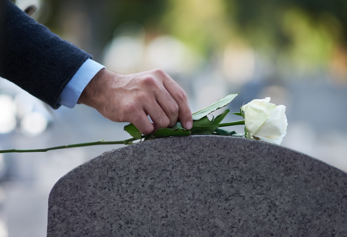 Man-paying-his-respects-grave
