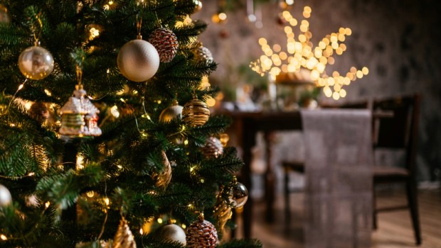 new year cozy home interior with christmas tree and garlands
