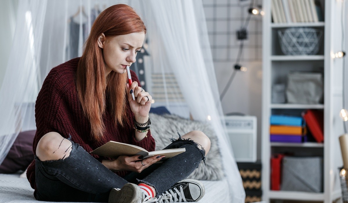 Young woman writer, serious