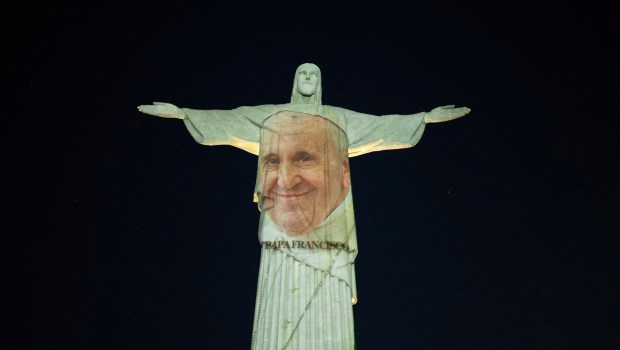 A picture of Pope Francis is projected on the Christ The Redeemer statue to launch his new book in Rio de Janeiro, Brazil