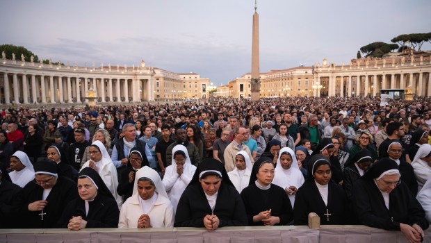 Devotees attend a Rosary in homage to Pope Francis following his death in Saint Peter's Square, the Vatican, on April 21, 2025