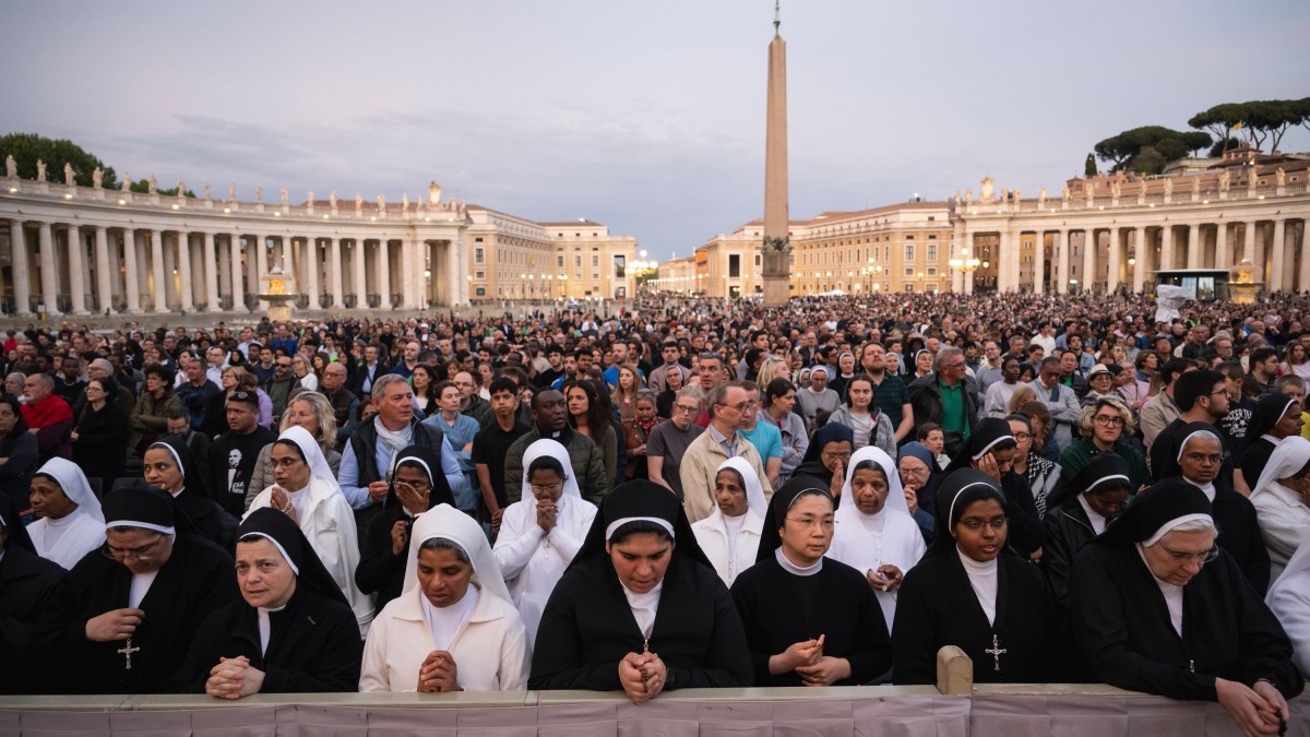 Devotees attend a Rosary in homage to Pope Francis following his death in Saint Peter's Square, the Vatican, on April 21, 2025
