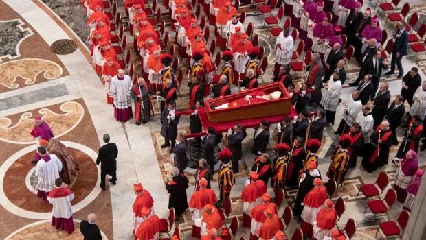 Pallbearers carry the coffin of the late Pope Francis inside St Peter's Basilica as it is transported in a procession from the chapel of Santa Marta to St Peter's Basilica, following the Pope's death, in the Vatican on April 23, 2025.