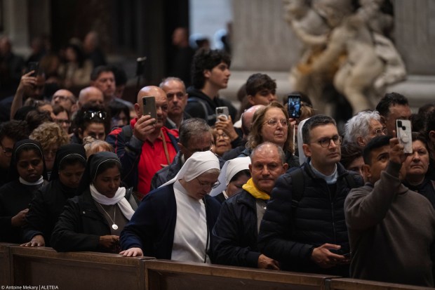People queue at St Peter's Basilica to pay their respects to late Pope Francis as he lies in state in The Vatican, on April 24, 2025.