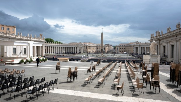 Workers operate to build a structure for media positions as part of preparations of the Pope's funeral with a view of the St Peter's square in the background near The Vatican, in Rome on April 24, 2025. The Vatican said on April 24, 2025, that nearly 50,000 people had so far paid their respects to Pope Francis, whose body is lying in state at St Peter's Basilica for three days before his funeral.