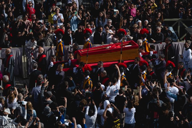 Pallbearers carry the coffin of the late Pope from the chapel of Santa Marta to St. Peter's Basilica in the Vatican on April 23, 2025.